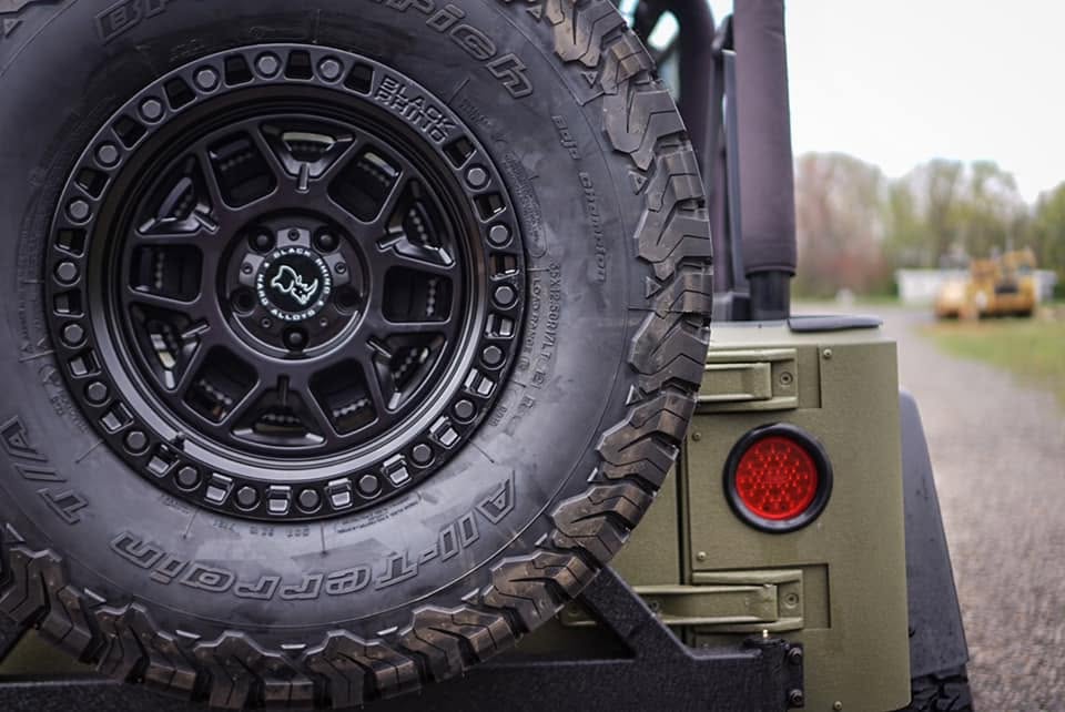 Close-up of an off-road wheel and tire on a modified Jeep